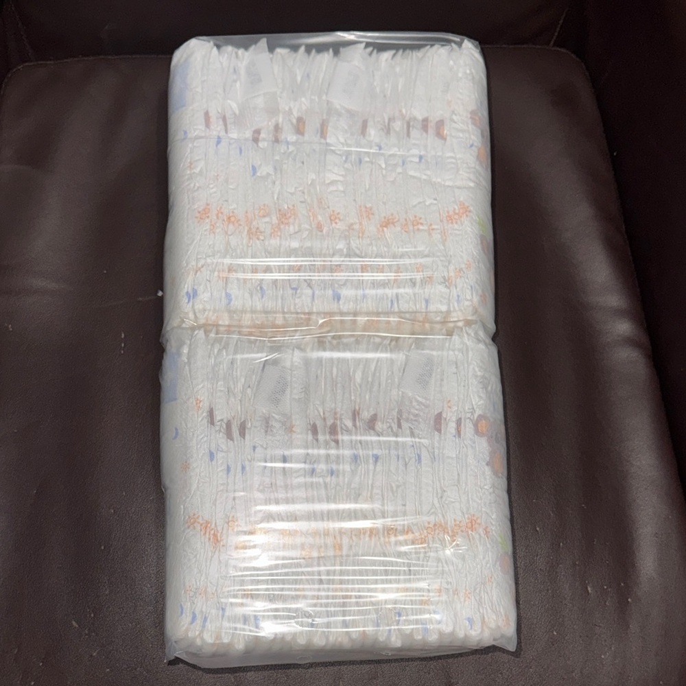 56 Pack of White Baby Diapers with Subtle Pastel Prints